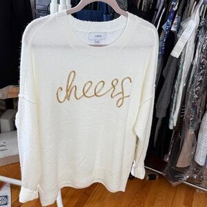 CeCe Cream Sweater with Gold 'Cheers' Design Ptp 28” L27”